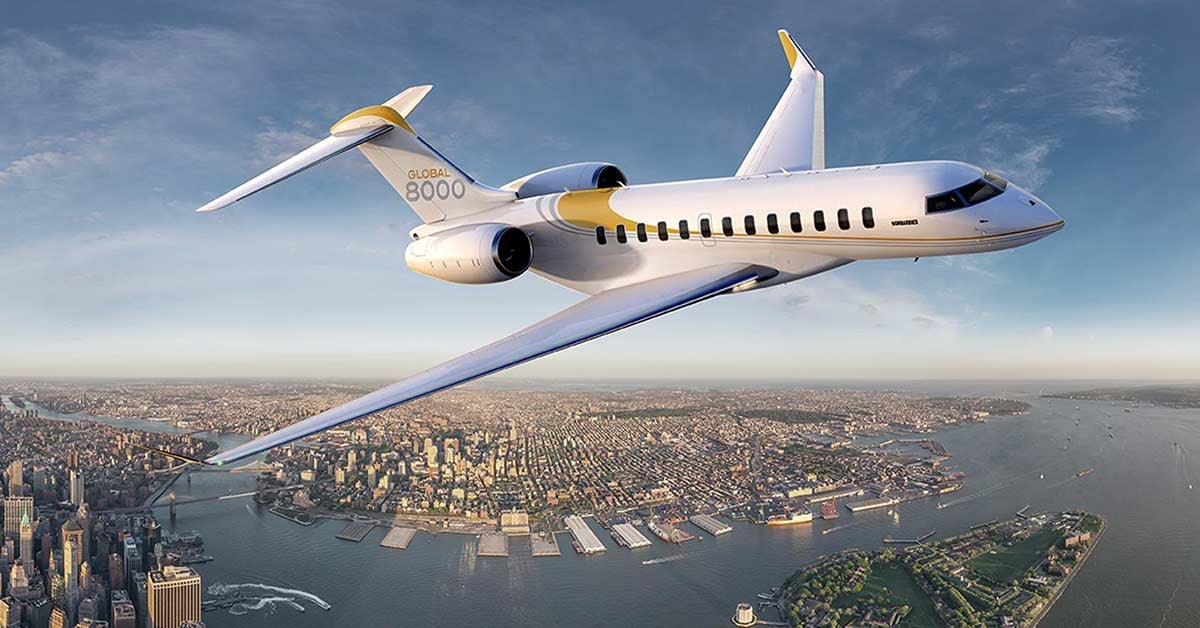 bombadier Global 8000 flying over a city