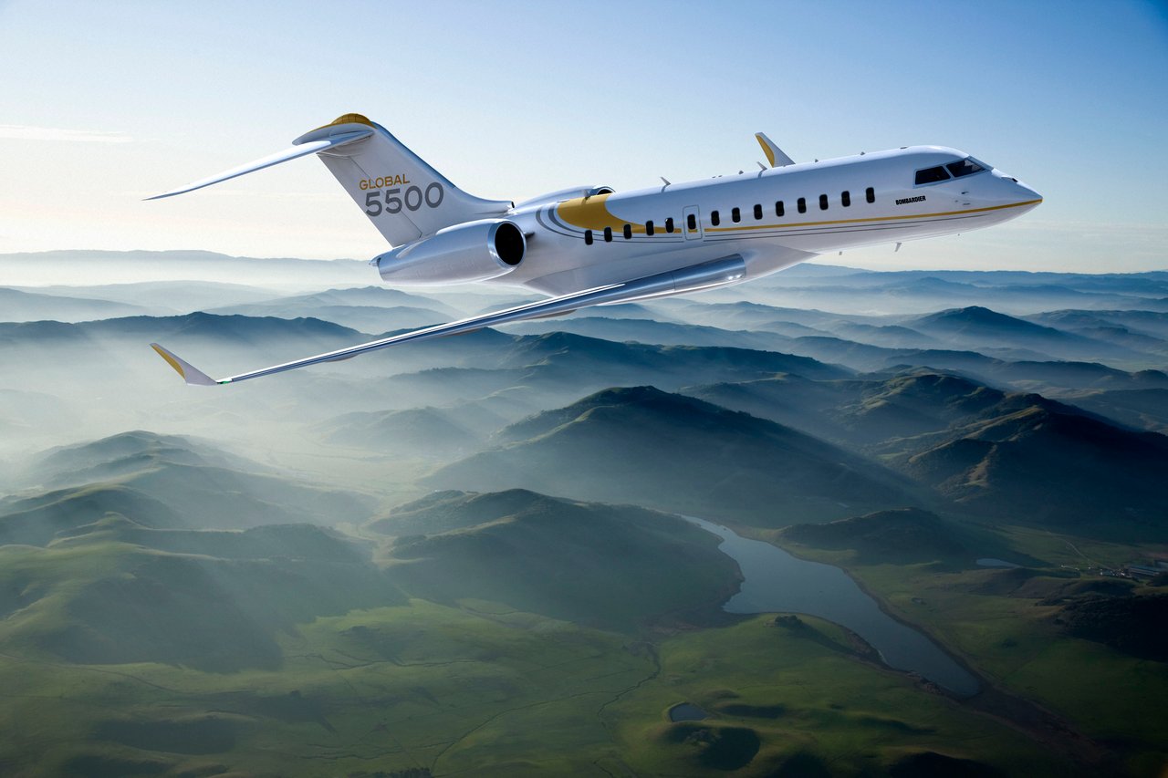bombardier global 5500 flying over mountains